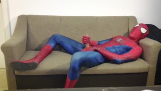 Horny Spiderman jerks off and cums massive load